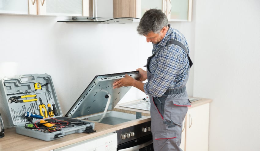 Man fixing appliances